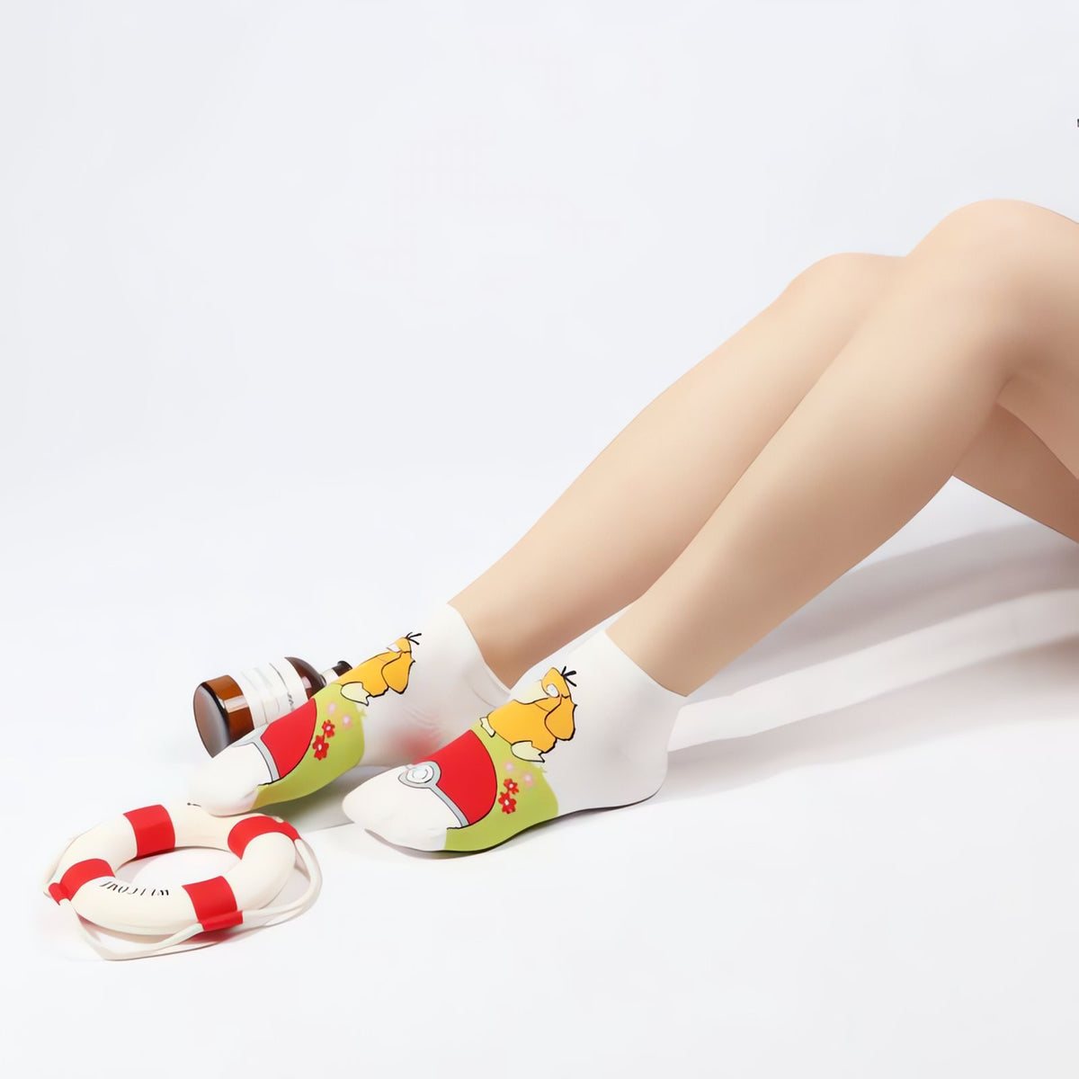 Colourful Pokémon socks with a Poké Ball kick design – Psyduck
