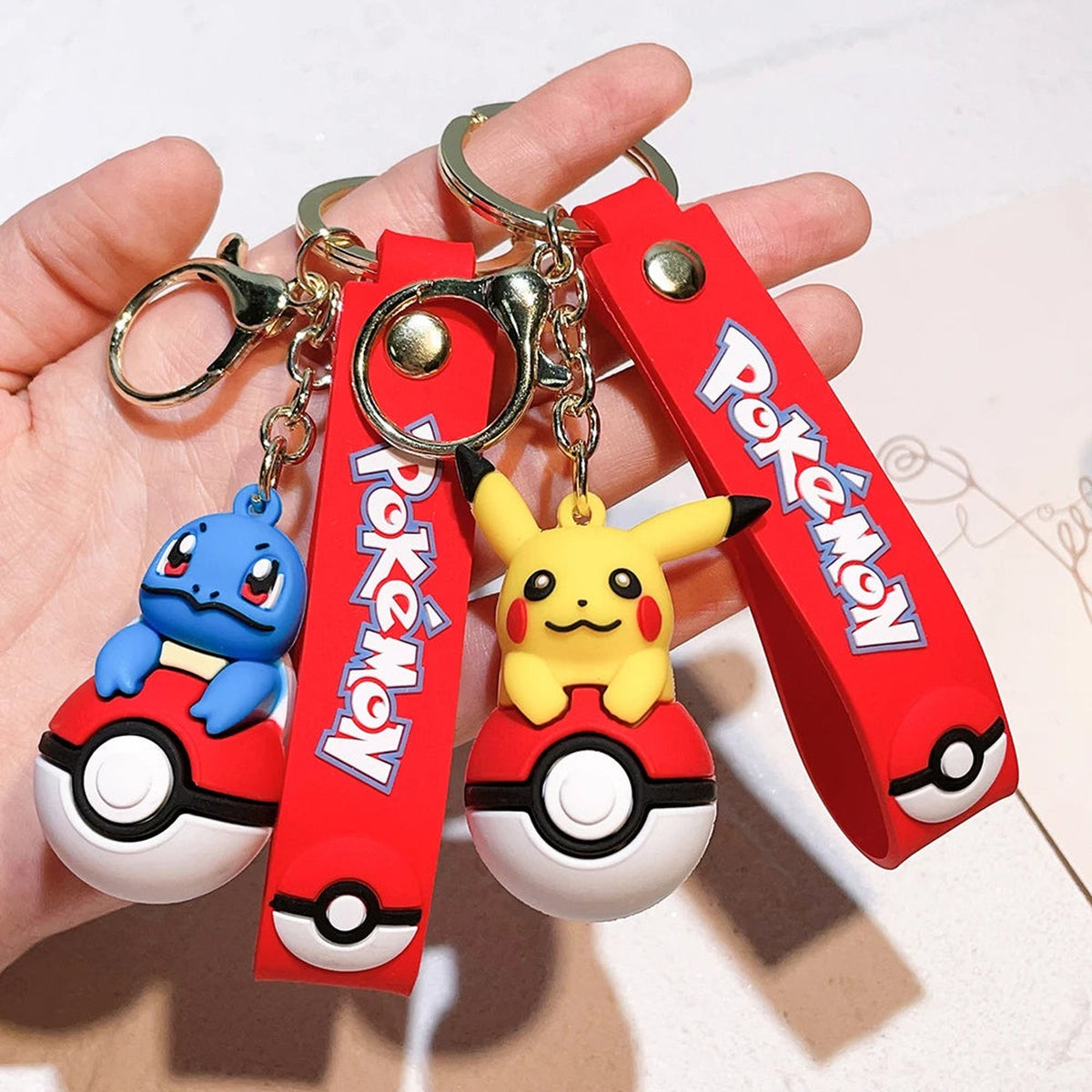 Poké Ball keyring with Pokémon figure charm
