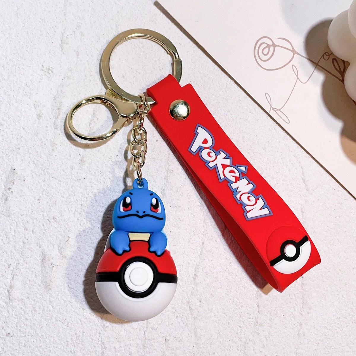 Poké Ball keyring with Pokémon figure charm – Squirtle