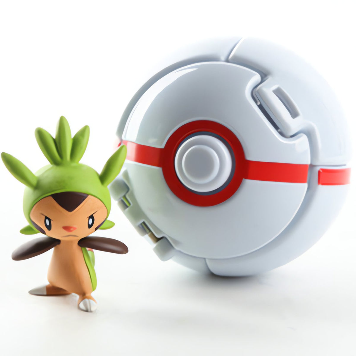 Poké Ball with a mini Pokémon figure – Chespin