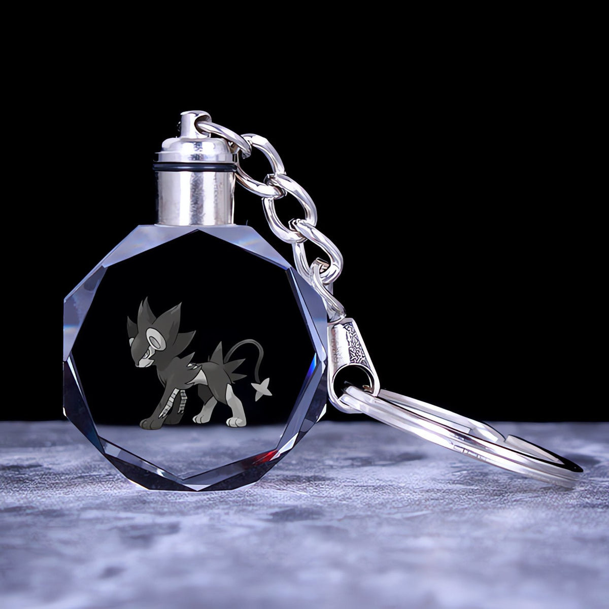 Pokémon crystal keyring with a glowing 3D Pokémon – Luxray