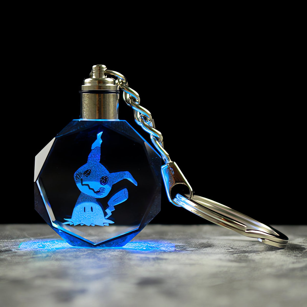 Pokémon crystal keyring with a glowing 3D Pokémon – Mimikyu