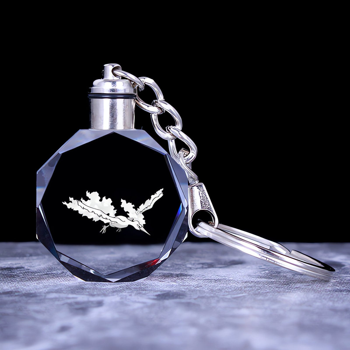 Pokémon crystal keyring with a glowing 3D Pokémon – Moltres