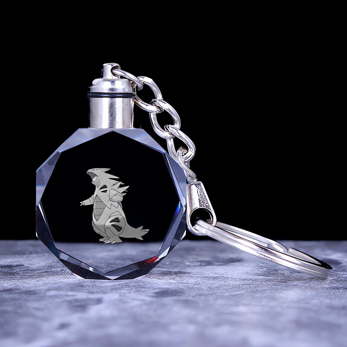 Pokémon crystal keyring with a glowing 3D Pokémon – Tyranitar