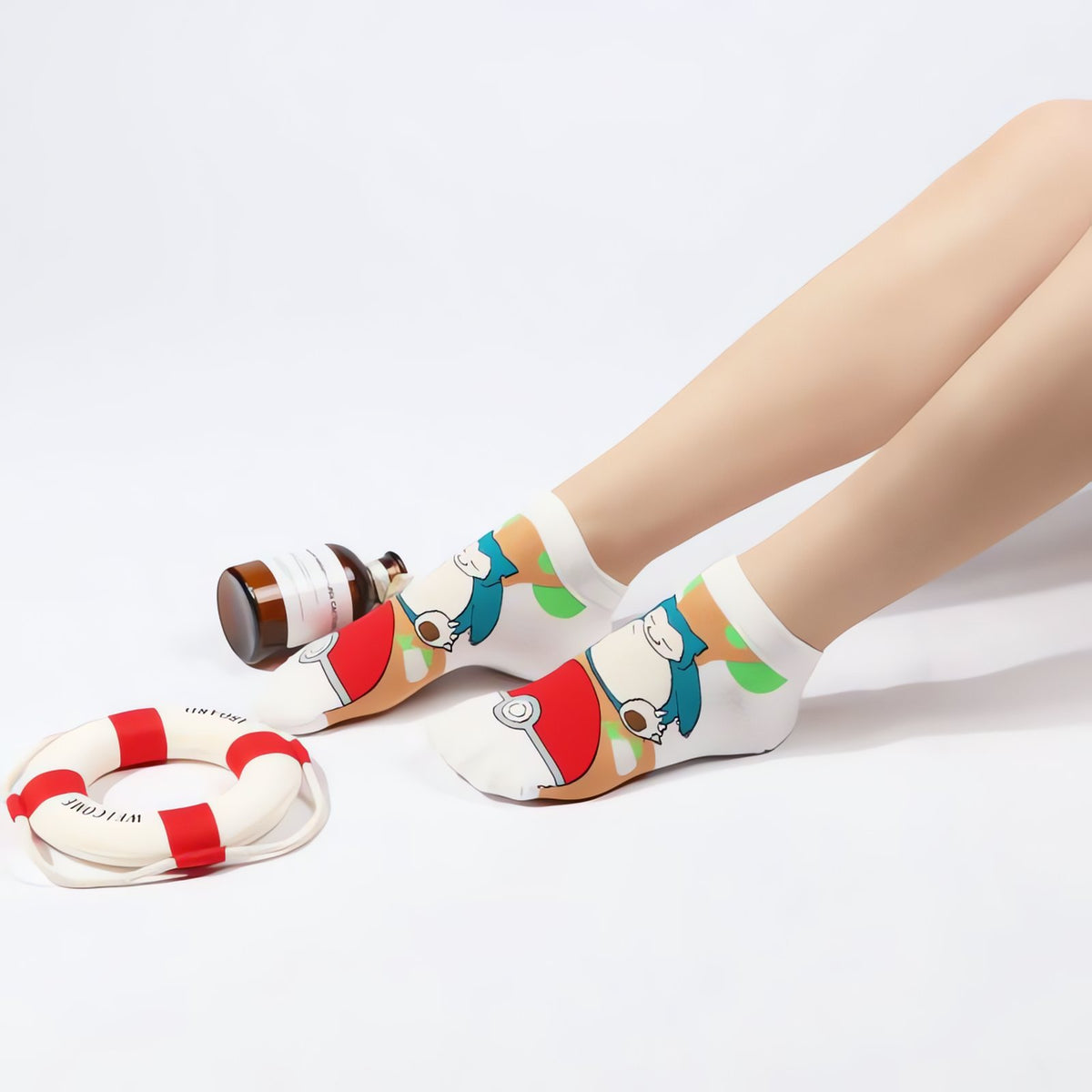 Colourful Pokémon socks with a Poké Ball kick design – Snorlax