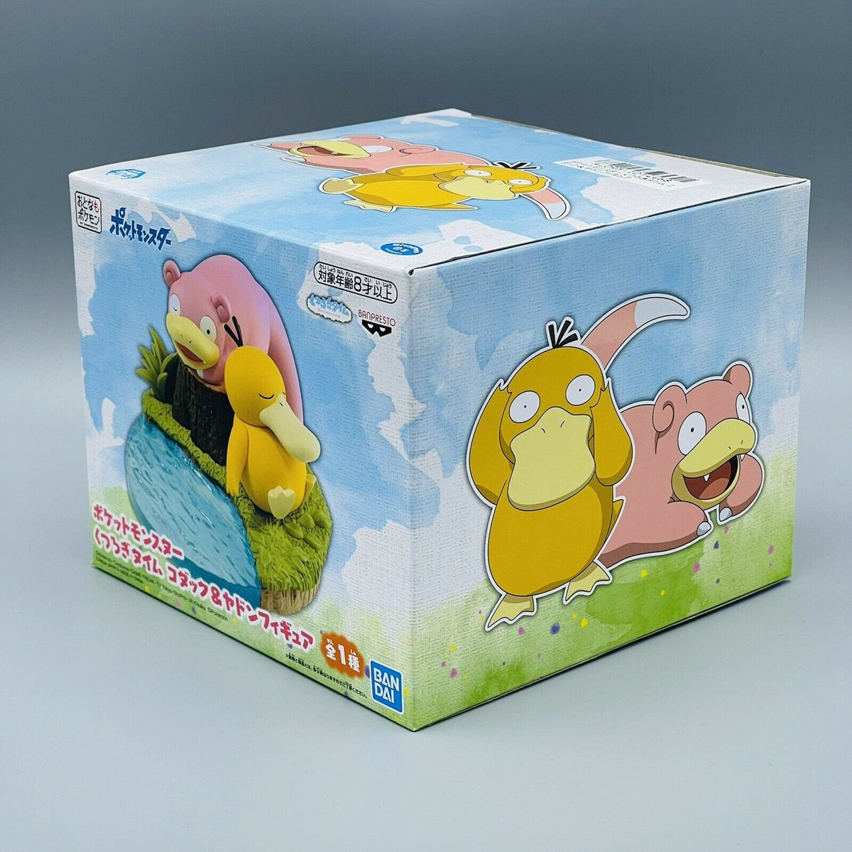 Slowpoke and Psyduck figure resting by a tree stump – photo 5